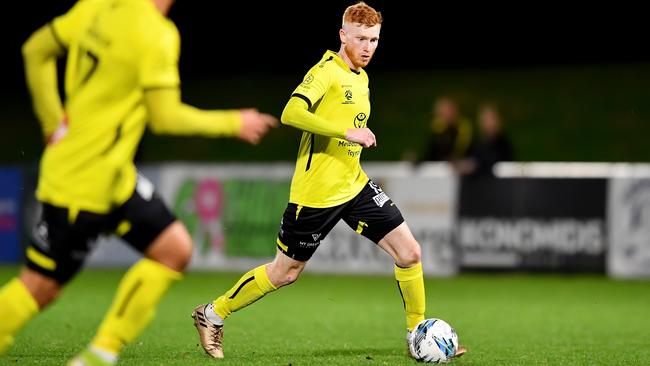 Sean Ellis of Heidelberg United runs with the ball during the round 10 NPL Victoria Men's match between Heidelberg United and North Geelong Warriors at Olympic Park in Heidelberg West, Victoria on April 21, 2023.