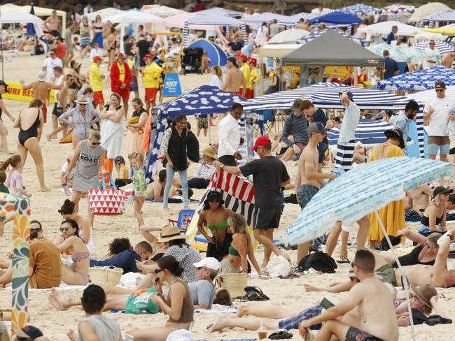 Crowds flock to Noosa Main Beach on Easter Sunday. Picture Lachie Millard