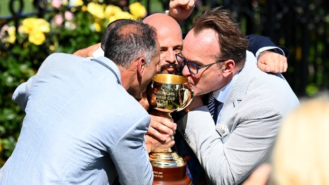 Verry Elleegant owners Brae Sokolski and Ozzie Kheir with other connections, celebrating with the Melbourne Cup. Picture: Quinn Rooney/Getty Images
