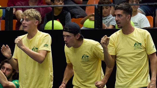 Cruz Hewitt (left) with Alex de Minaur (centre) and Thanasi Kokkinakis after he travelled with Australia’s Davis Cup team to Spain as the ‘orange boy’ in September. Picture: Angel Martinez / Getty Images