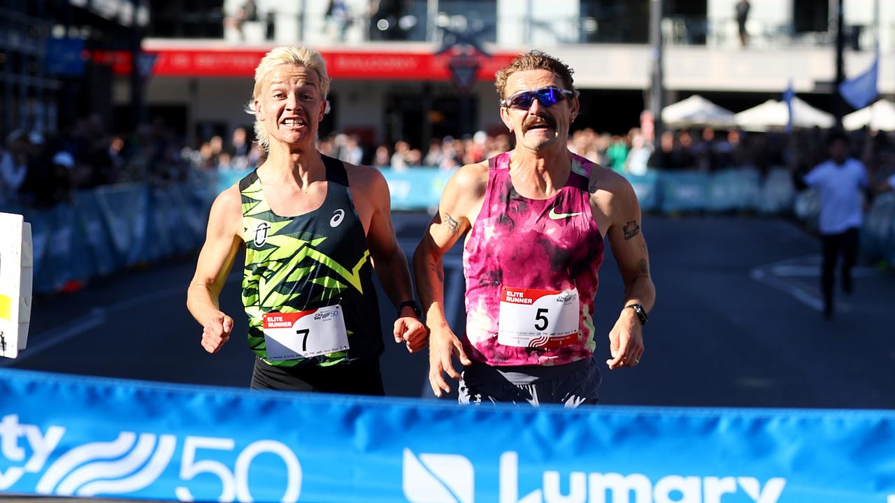 The 2024 Lumary City-Bay Fun Run. Elite winner Isaac Heyne crosses the finish line in front of Jack Rayner. Picture: Kelly Barnes