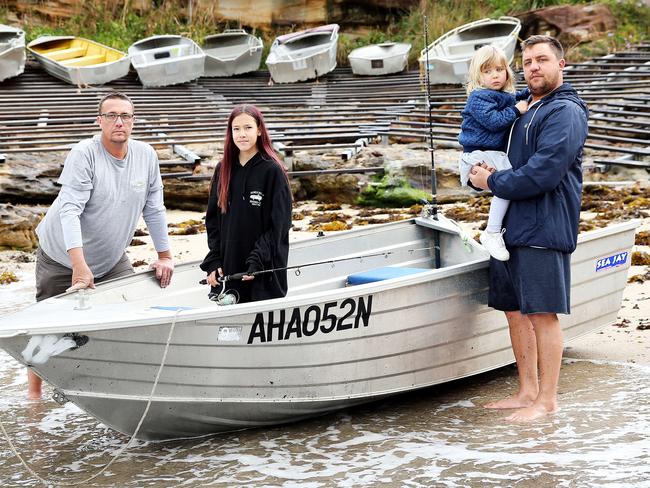 Gordon’s Bay Fishing Club members Ryan Bellingham with his three-year-old daughter Zara, and Paul Jackson and his daughter Piper. Picture: Tim Hunter.