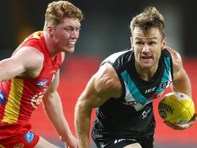 GOLD COAST, AUSTRALIA - MARCH 21: Robbie Gray of the Power runs the ball during the round 1 AFL match between the Gold Coast Suns and the Port Adelaide Power at Metricon Stadium on March 21, 2020 in Gold Coast, Australia. (Photo by Chris Hyde/Getty Images)