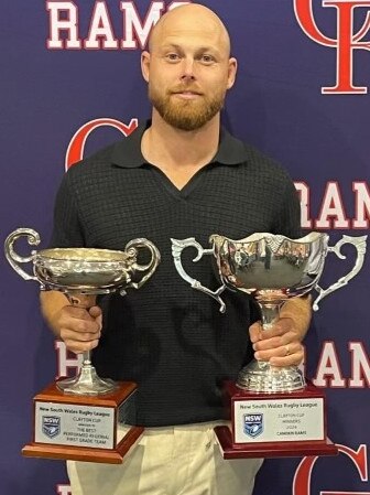 Camden Rams captain-coach Brad Speechley with the Macarthur Premiership Cup and the Clayton Cup. Picture: Camden Rams