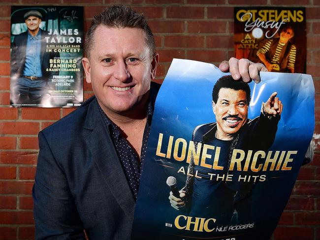 Managing Director at Space Events  Phil Rankine with some of the promotional posters of the  past and upcoming acts he has promoted over the last year. Pictured in Cordwainers Lane, Adelaide. picture: Bianca De Marchi