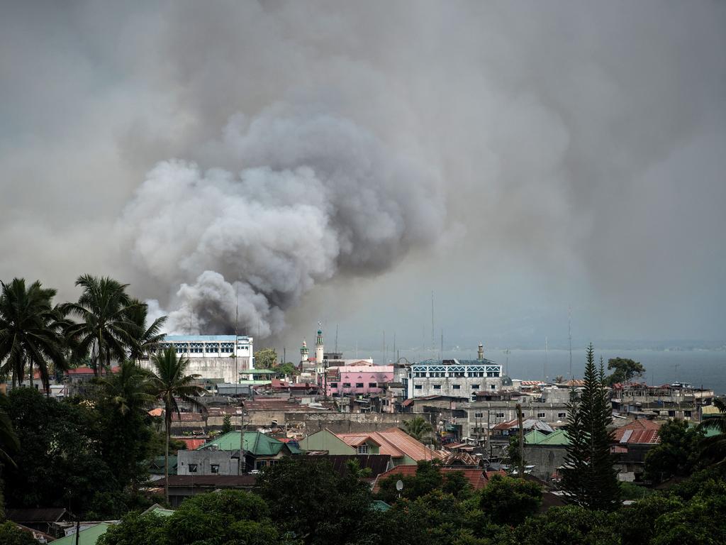 Smoke rises after aerial bombings by Philippine air force planes on Islamist militant positions in Marawi on the southern island of Mindanao on June 14, 2017. Picture: AFP