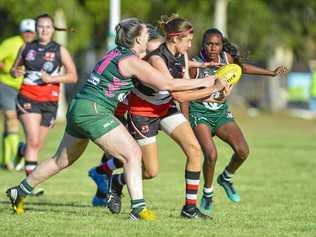 BITS Saints Sophie Ure looks to get a handball away against Gladstone Mudcrabs. Picture: Matt Taylor GLA190518AFLW