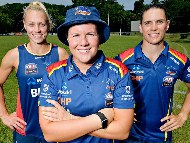 Former Adelaide Crows coach Bec Goddard (centre) has quit the AFLW.