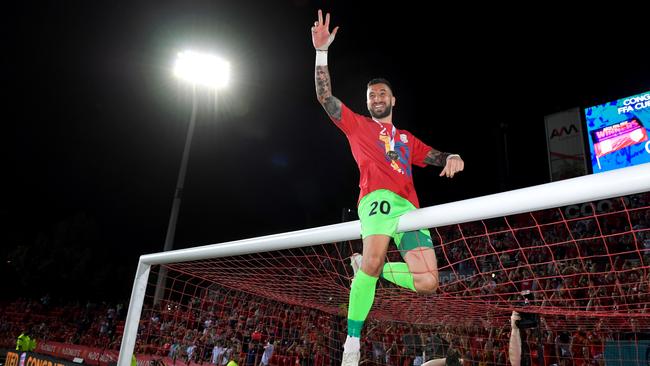 SA-born custodian Paul Izzo celebrates Adelaide United’s FFA Cup final win over Melbourne City on the Hindmarsh Stadium crossbar. Picture: Mark Brake/Getty Images