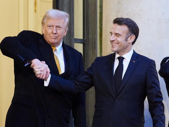 PARIS, FRANCE - DECEMBER 7: French President Emmanuel Macron meets with President-Elect Donald Trump at the Elysee Palace on December 7, 2024 in Paris, France. Donald Trump was among the wave of foreign dignitaries descending on Paris this weekend to attend a reopening ceremony at Notre-Dame Cathedral, more than five years after it was damaged in a major fire. (Photo by Oleg Nikishin/Getty Images)