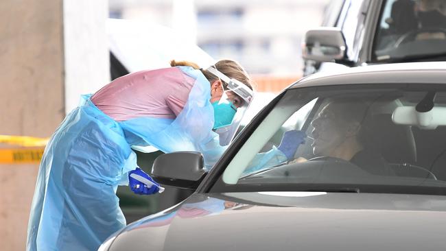 A man is tested for Covid-19 at a drive through clinic in Bowen Hills in Brisbane. Picture: NCA NewsWire / Dan Peled.