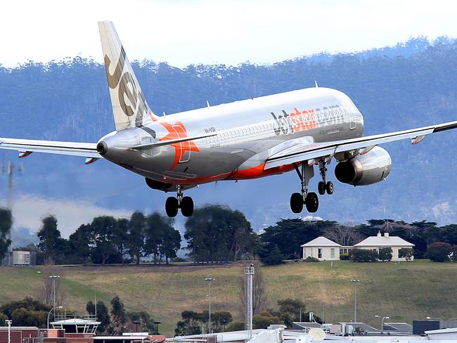 SUNTAS: Generic shots of planes taking off or coming into land, at Hobart Airport. a Jetstar plane landing