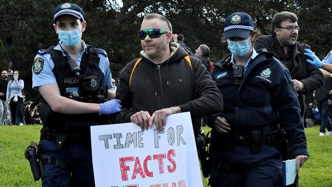 Police make another arrest during the demonstration.