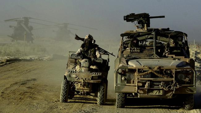 Australian Army SAS troopers patrol in Afghanistan with long-range patrol vehicle in 2002.