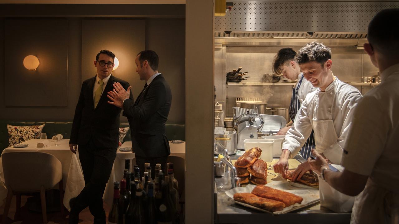 A thin wall divides the busy, buzzy, chefs from the calm, warm and welcoming ambience in the dining room at Adam Byatt’s Michelin-starred Trinity Restaurant in Clapham, London. Picture: John Carey/Pink Lady® Food Photographer of the Year