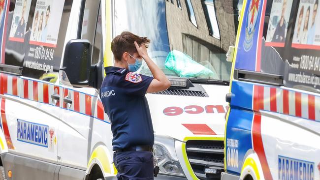 MELBOURNE, AUSTRALIA - NewsWire Photos 18 JANUARY 2022 : VictoriaÃs hospital system is under extreme pressure due to the covid-19 Omicron variant and a ÃCode brownÃ has been enforced.This will enable hospitals to cancel their staffs leave to ensure an adequate workforce is on hand. Ambulances parked at St VincentÃs Hospital. Picture : NCA NewsWire / Ian Currie