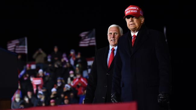 US President Donald Trump and Vice President Mike Pence at Gerald R. Ford International Airport in Michigan. Picture: AFP