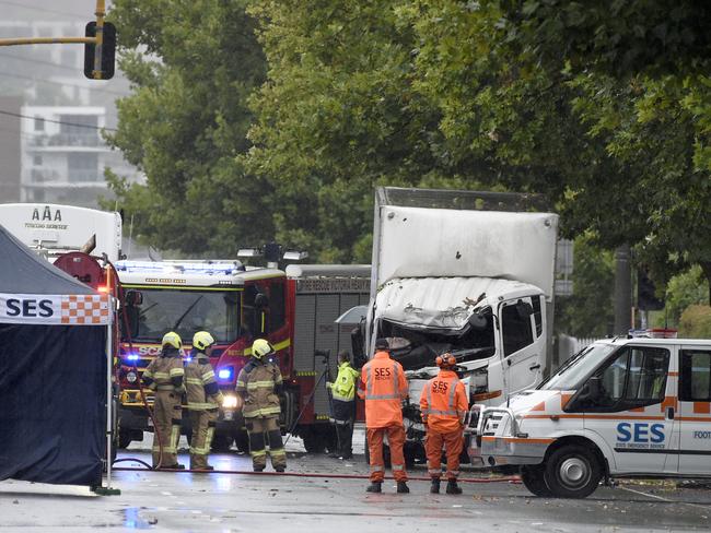 Police and fire crews at the scene on Monday. Picture: Andrew Henshaw