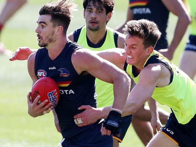 AFL - Crows training + Press Conference - Thursday, 19th August, 2021 - at the Adelaide Oval. Ben Keays gets tackled by Lachlan Gollant who will make his debut this weekend Picture: Sarah Reed