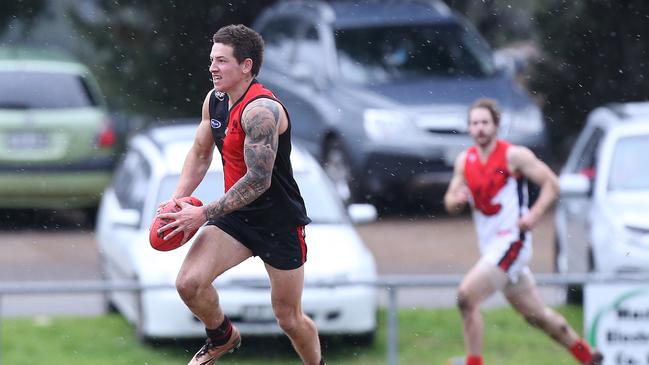 Blake Carter, pictured playing for Morphett Vale two years ago, was influential in Christies Beach’s 101-point win over the Emus on Saturday. Picture: Stephen Laffer