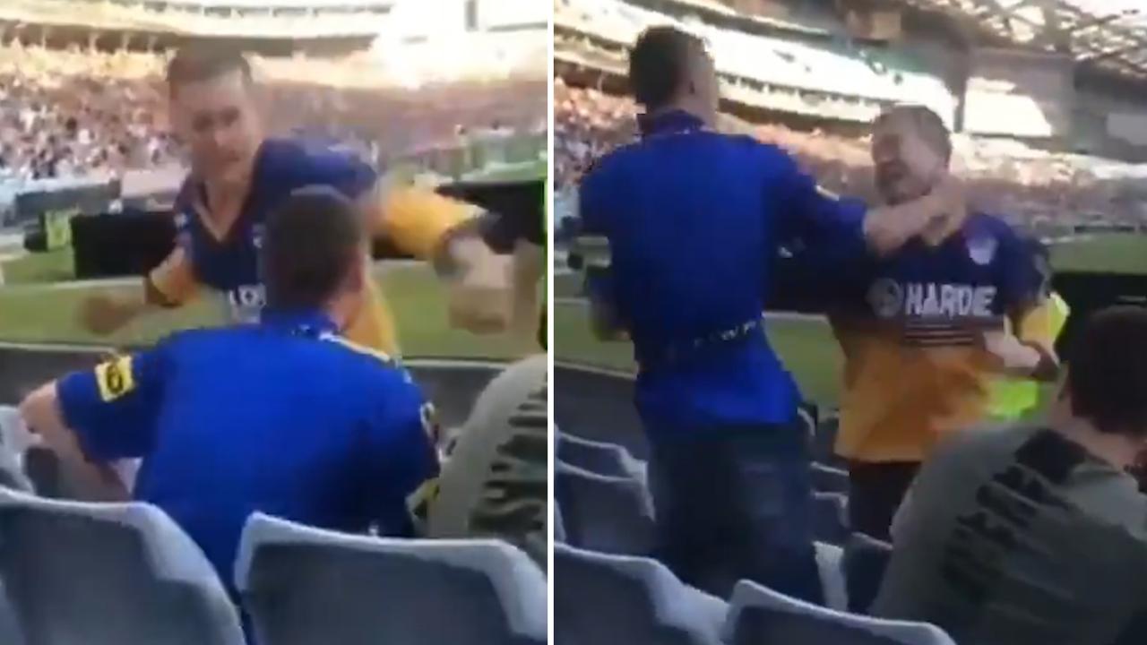 Two men are pictured trading punches at Stadium Australia.