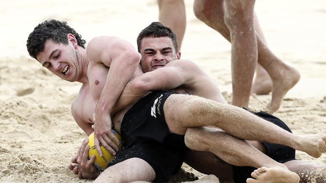 Beach wrestling with Karl Amon at Maroochydore on their pre-season camp last year. Picture: Sarah Reed.