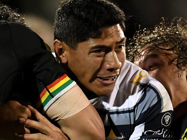 Jason Taumalolo of the Cowboys is tackled by Corey Harawira-Naera and James Fisher-Harris of the Panthers during the Round 9 NRL match between the Penrith Panthers and the North Queensland Cowboys at Carrington Park in Bathurst, Friday, May 4, 2018. (AAP Image/Dean Lewins) NO ARCHIVING, EDITORIAL USE ONLY