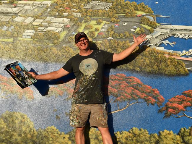 Andrew Grassi Kelaher in front of his new mural in Tewantin