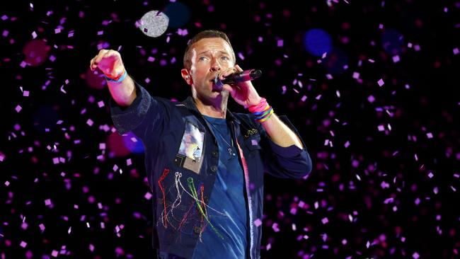 Chris Martin from Coldplay on stage at Accor Stadium at Sydney Olympic Park for their Music Of The Spheres World Tour concert. Picture: Jonathan Ng