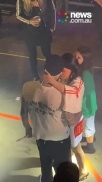 Kourtney filmed praying with Travis before he heads onstage