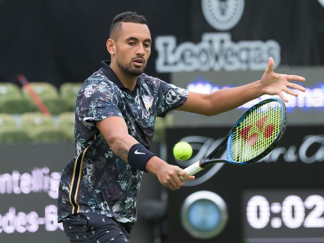 Australia's tennis player Nick Kyrgios returns the ball to Italy's Matteo Berrettini during their first round match at the ATP tennis tournament in Stuttgart on June 11, 2019. (Photo by Silas Stein / dpa / AFP) / Germany OUT