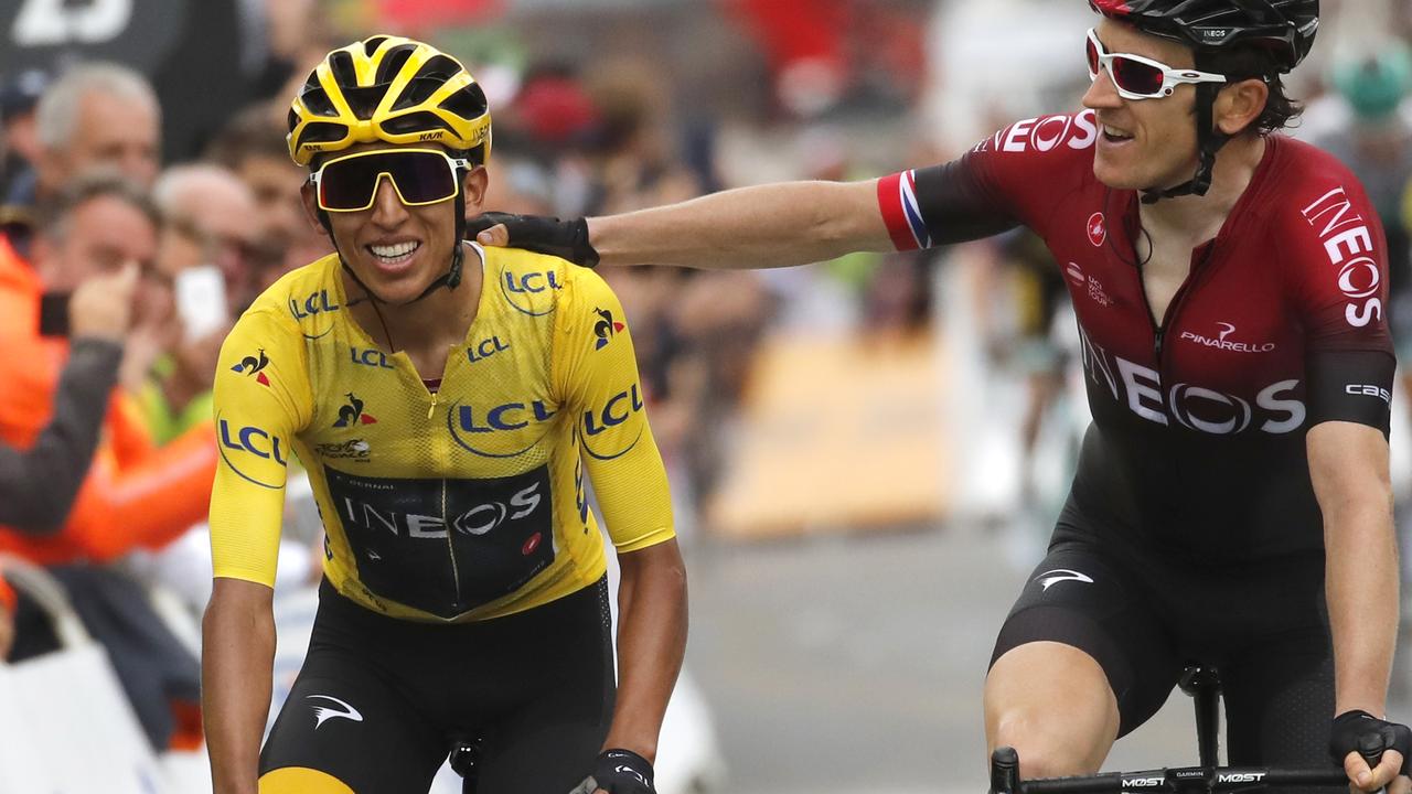 Britain's Geraint Thomas, right, congratulates Colombia's Egan Bernal wearing the overall leader's yellow jersey as they crosses the finish line of the twentieth stage.