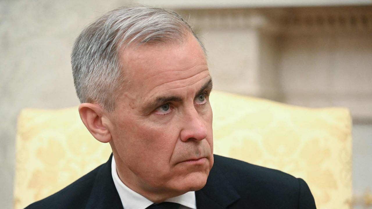 Canadian Prime Minister Mark Carney had to keep a poker face at times. (Photo by Jim WATSON / AFP)