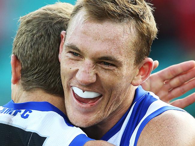 North Melbourne's Drew Petrie and Nick Dal Santo celebrate victory over the Sydney Swans during AFL match at the SCG. pic. Phil Hillyard