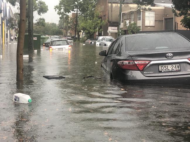 Flash flooding in Carrington Road and Renwick in Sydney's Inner West. Picture: Peter Lalor