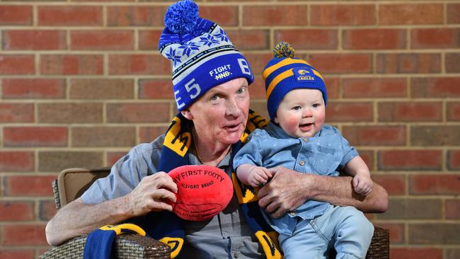 Graham Johnson poses for a photograph with his grandson Hunter. Picture: Keryn Stevens/AAP