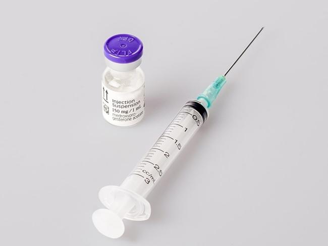 A contraceptive injection needle and vial.