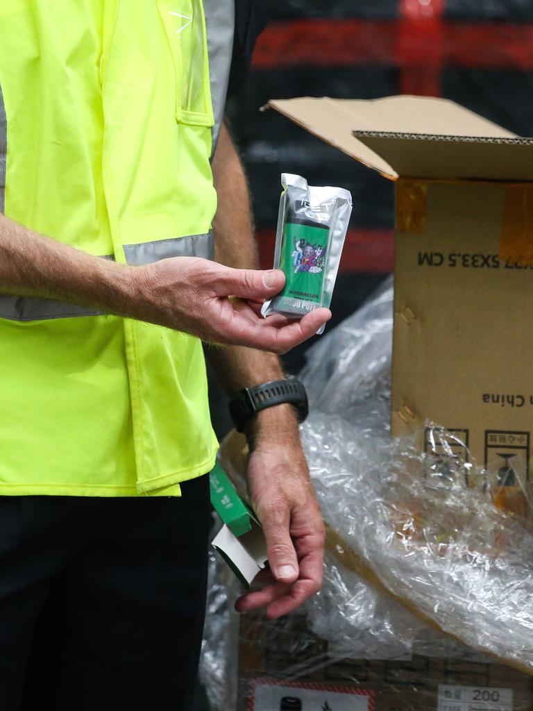 A staff worker unpacks a shipment of vapes at the Border Force Facility in Port Botany as Australia’s vaping reforms come into effect. Picture: NCA Newswire /Gaye Gerard