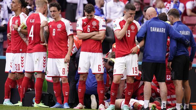 Denmark's players react as paramedics attend to Denmark's midfielder Christian Eriksen after he collapsed on the pitch during the UEFA EURO 2020 Group B football match. Picture: Liselotte Sabroe / Ritzau Scanpix / AFP