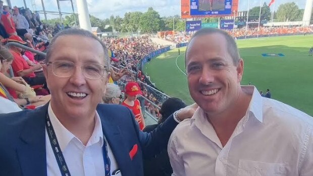 GoldCoast Division 11 candidate Dan Doran with Mark Witheriff (on the left) at the first home games for the Suns, taking a rare break in the lead-up to the March 16 poll.