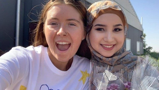 Close friend Abbey Gawne with Ms Haidari at their graduation, two months before Ms Haidari was killed.