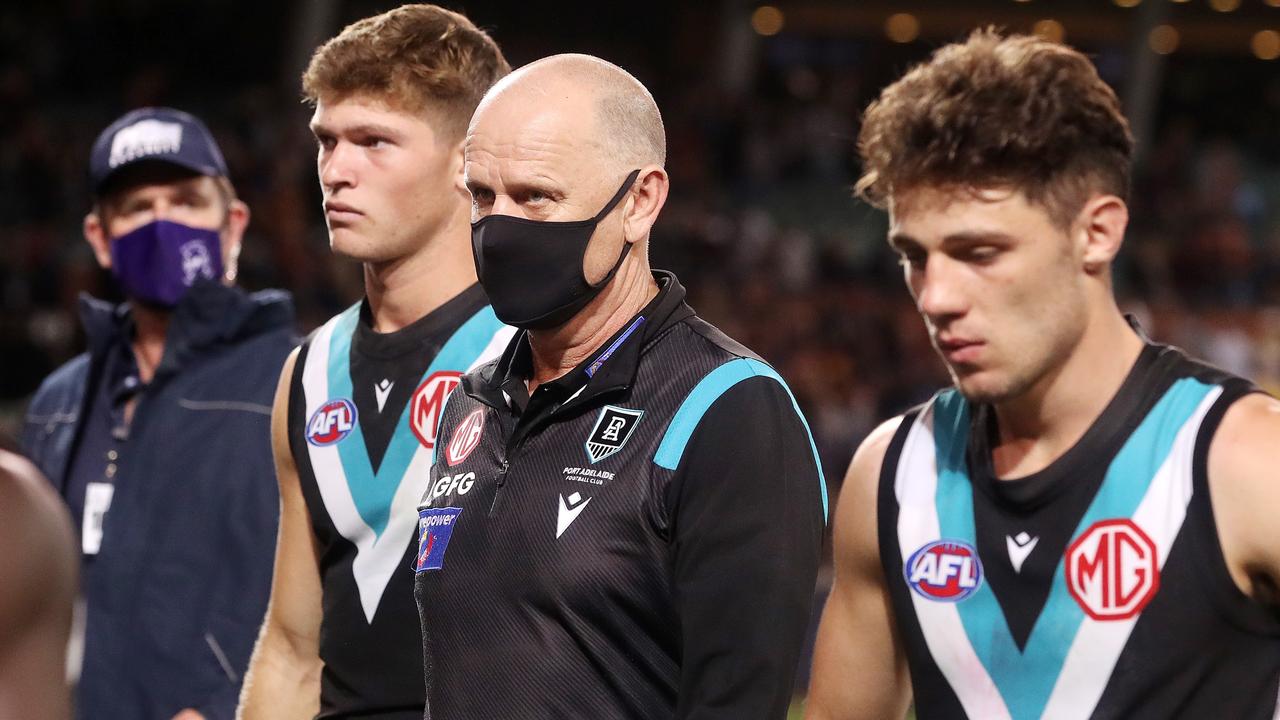 ADELAIDE, AUSTRALIA - APRIL 01: Ken Hinkley walks off with his players after the loss during the 2022 AFL Round 03 match between the Adelaide Crows and the Port Adelaide Power at Adelaide Oval on April 01, 2022 In Adelaide, Australia. (Photo by Sarah Reed/AFL Photos via Getty Images)