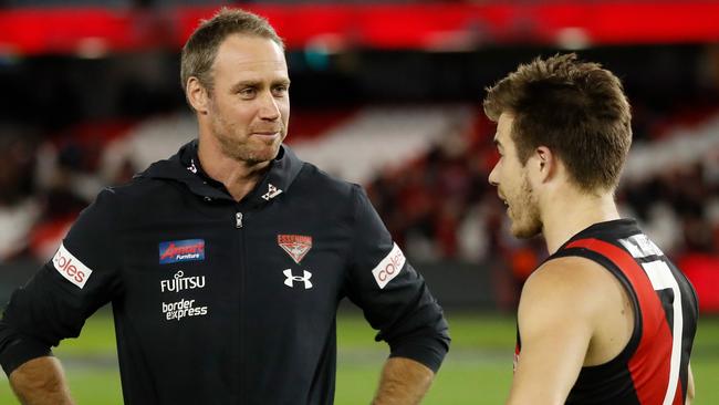 Ben Rutten chats with his top midfielder Zach Merrett, who came in for some serious attention against Fremantle. Picture: AFL Photos via Getty Images