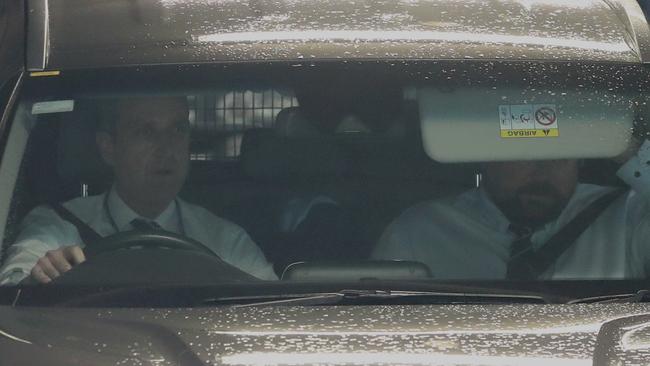 Stuart MacGill was seen hiding in the back seat of a police car on Wednesday morning. Picture: John Grainger