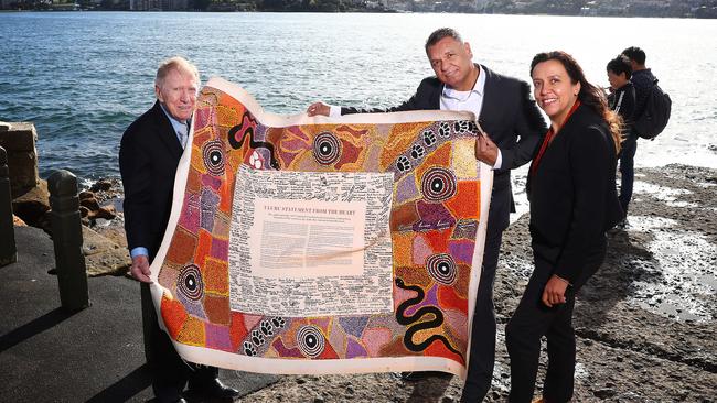 Film maker Rachel Perkins, Former High Court judge Michael Kirby and Uphold and Recognise chairman Sean Gordon with the Uluru Statement at Mrs Macquarie's Chair in Sydney.