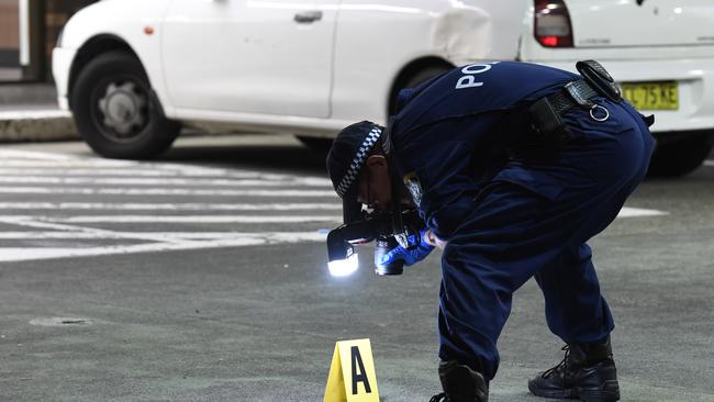 Forensic officers at the scene of the alleged attack Picture: Gordon McComiskie