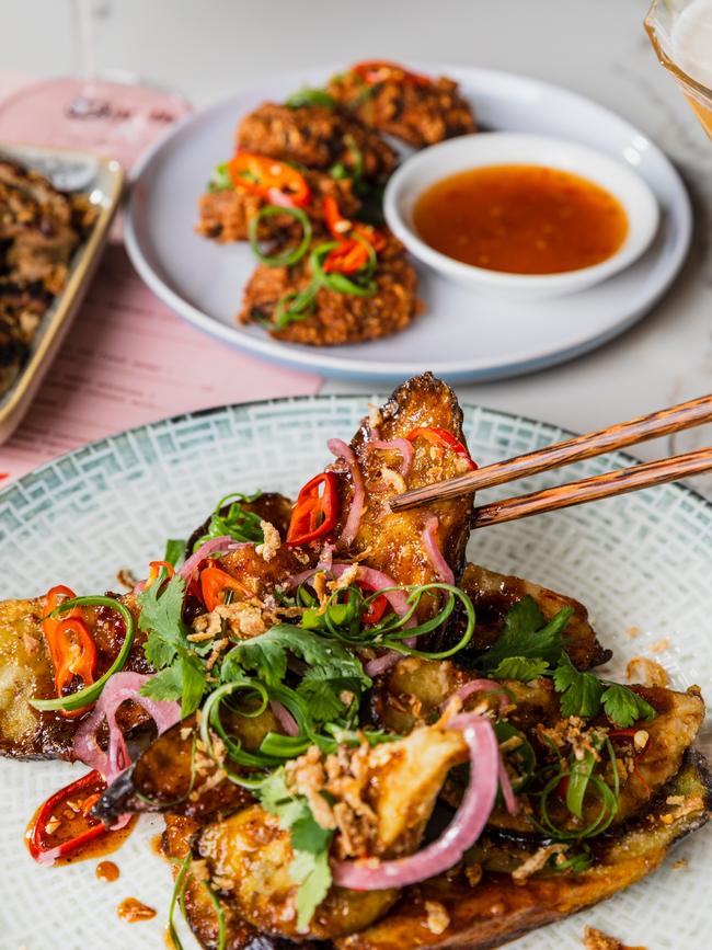 Mr Good Guy’s crispy, spiced eggplant dish features chunks of eggplant in a sticky caramel sauce topped with a flurry of fresh herbs, chilli and fried shallots. Picture: Olivia Sattler