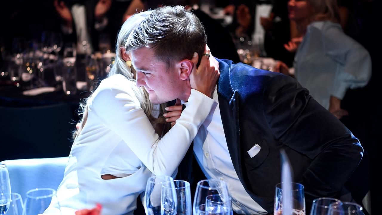 Ollie Wines embraces partner Olivia May during the 2021 Brownlow Medal Count at Optus Stadium. (Photo by Daniel Carson/AFL Photos via Getty Images).