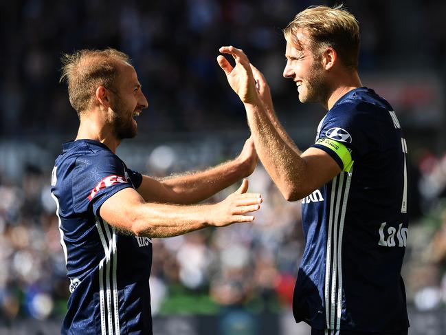 Migjen Basha (left) and Nils Ola Toivonen of Victory react after Ola Toivonen scored a goal during the Round 11 A-League match between the Melbourne City FC and the Melbourne Victory at AAMI Park in Melbourne, Saturday, December 21, 2019. (AAP Image/Julian Smith) NO ARCHIVING, EDITORIAL USE ONLY