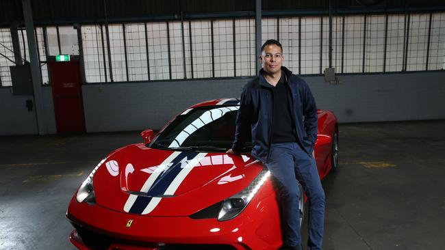 Sunny Tanjung, sales rep with Pickles auctions in Belmore in Sydney's West pictured with a second hand 2015 Ferrari 458 Speciale currently for sale. Picture: Britta Campion / The Australian